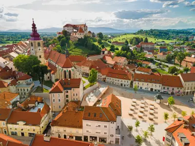 Ptuj in Slovenia Townscape. City Tower, Cathedral and Ptuj Castle. Drone View.