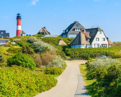 Road to lighthouse in Hornum village on southern coast of Sylt island, Germany