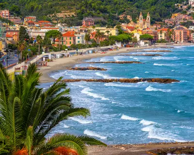 Sand beach in historical Laigueglia resort town on italian Riviera, Alassio, Liguria, Italy