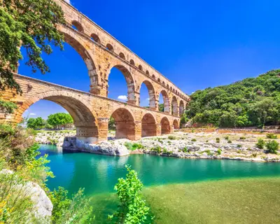 Pont du Gard three-tiered aqueduct was built in Roman times on the river Gardon. Provence summer day.