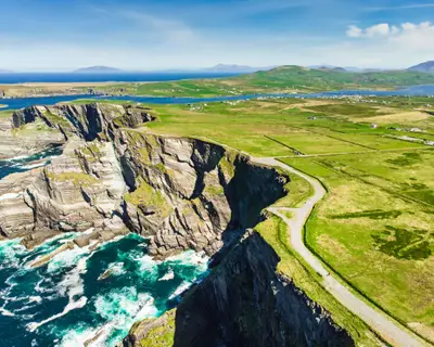 Amazing wave lashed Kerry Cliffs, widely accepted as the most spectacular cliffs in County Kerry, Ireland. Tourist attractions on famous Ring of Kerry route.