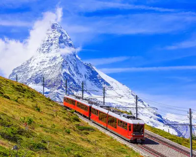 Zermatt, Switzerland. Gornergrat tourist train with Matterhorn mountain in the background. Valais region.