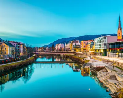 view of a riverside of river Drau during sunset in Villach, Austria