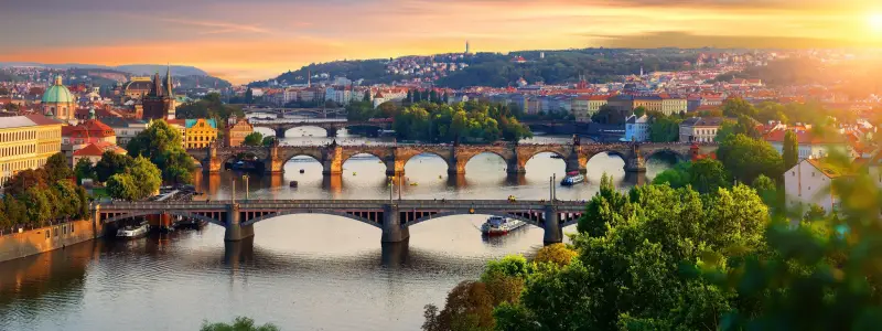 Overview of old Prague with Charles bridge at sunset