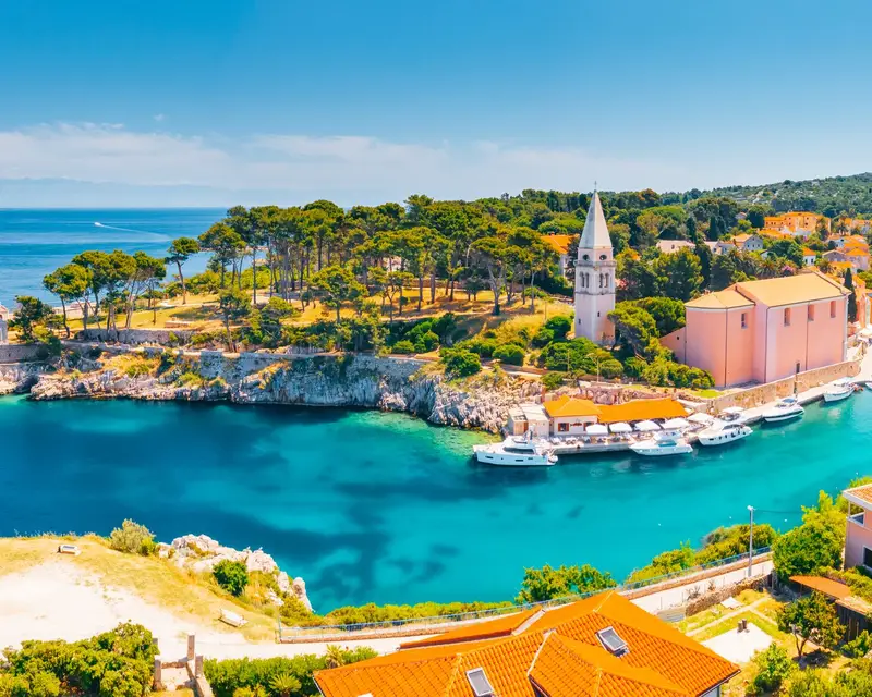 Scenic view of the blue lagoon village Veli Losinj on sunny day. Location place Kvarner Gulf, island Losinj, Croatia, Europe. Drone photography. Summer vacation concept. Discover the beauty of earth.